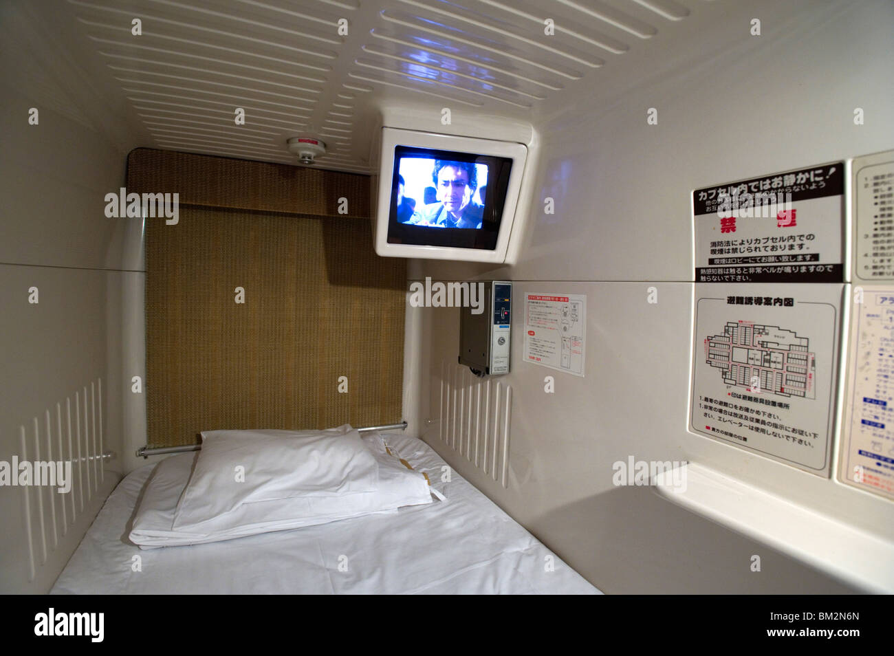 Interior view of single-person sleeping compartment at capsule hotel in Osaka, Japan Stock Photo