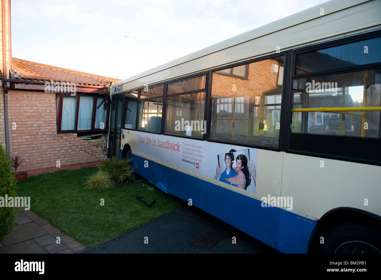 Single decker bus crashed into wall of house Stock Photo - Alamy