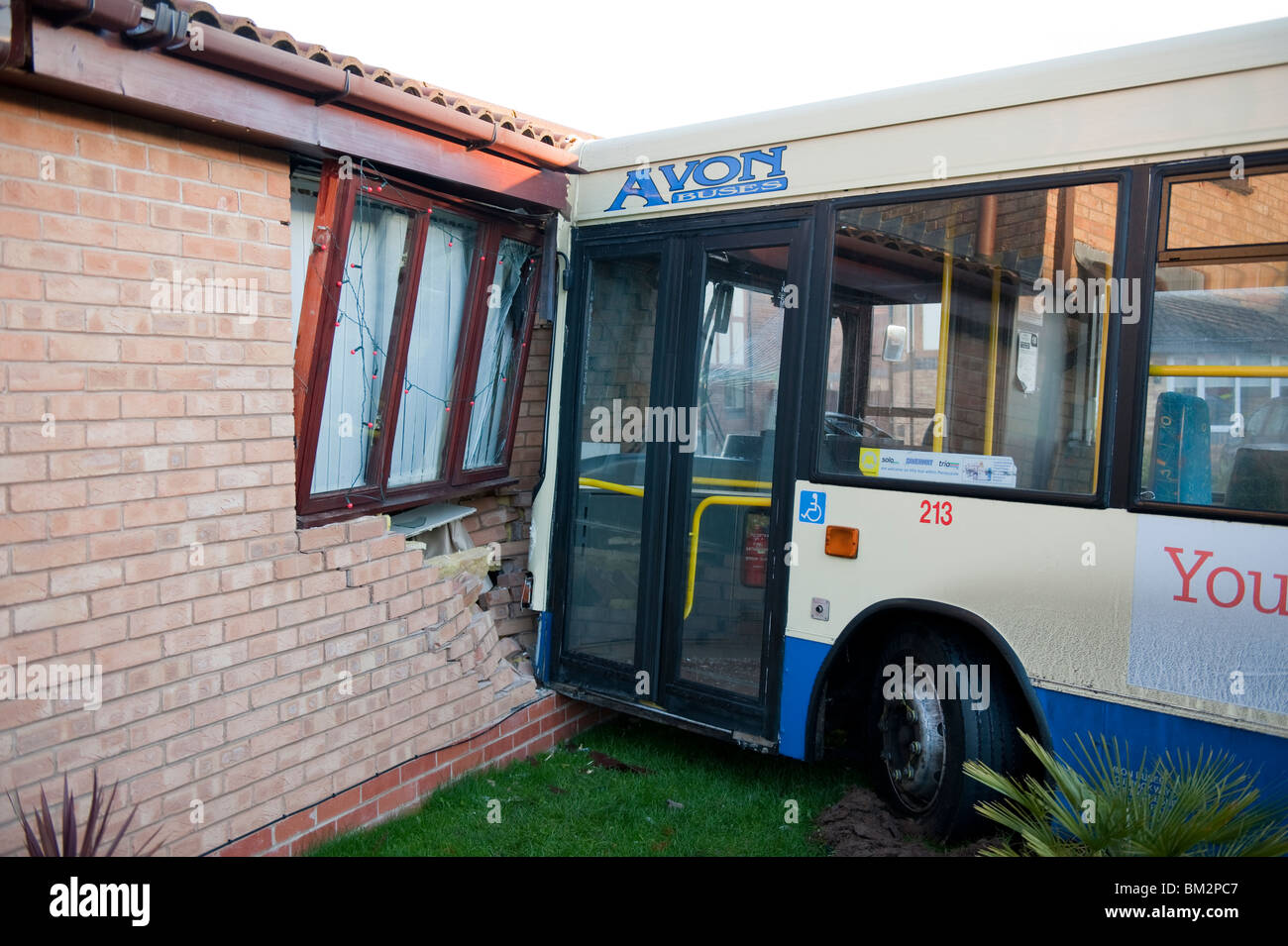 Single decker bus crashed into wall of house Stock Photo - Alamy