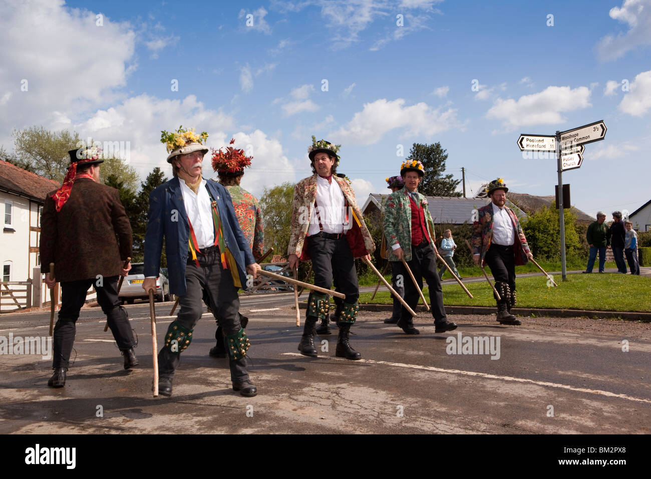 UK, England, Herefordshire, Putley, Big Apple Event, Morris men dancing with sticks on village green in sunshine Stock Photo