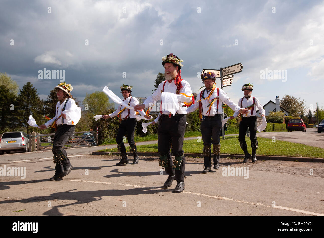 UK, England, Herefordshire, Putley, Big Apple Event, Morris men dancing on village green as rain storm aproaches Stock Photo