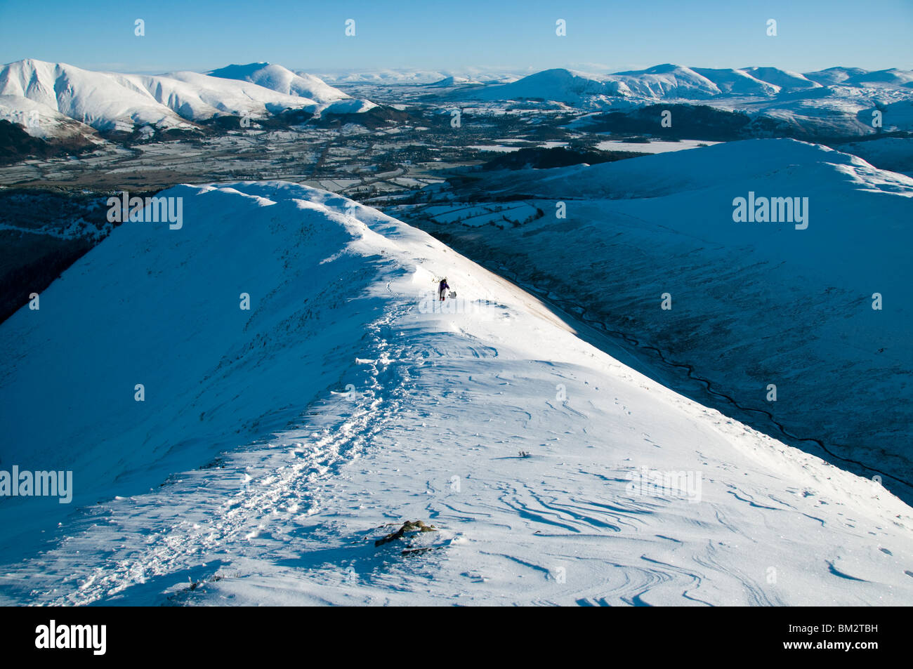 Blencathra and the Helvellyn range in winter from the Sleet How ridge of Grisedale Pike, Grasmoor Fells, Lake District, Cumbria, England, UK Stock Photo