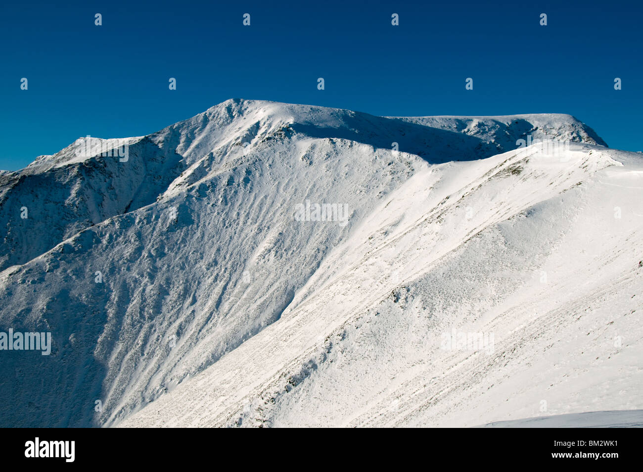 Blencathra summit from the Scales Fell ridge in winter, Lake District, Cumbria, England, UK Stock Photo
