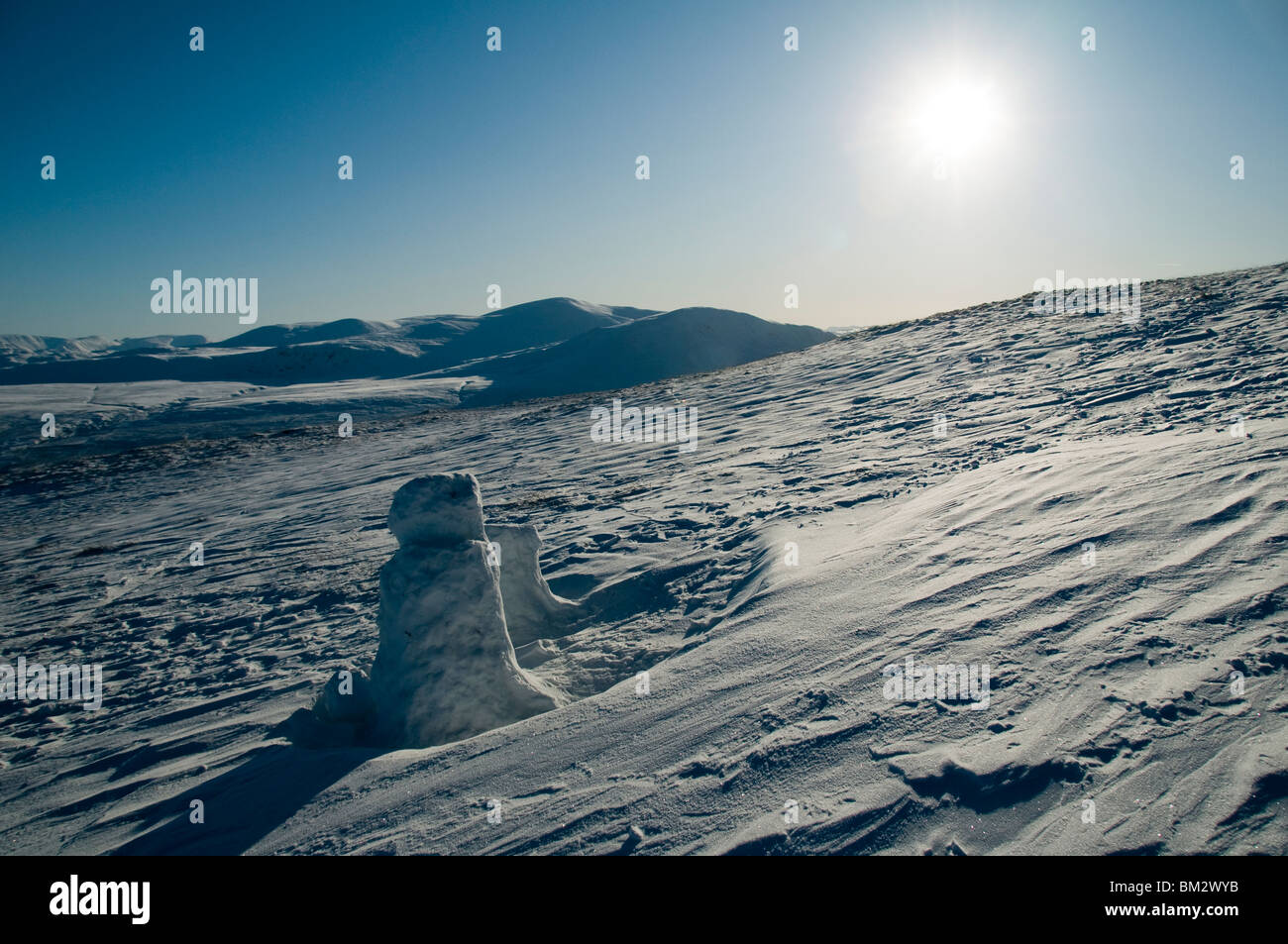 A snowman on the Scales Fell ridge of Blencathra in winter, Lake District, Cumbria, England, UK Stock Photo