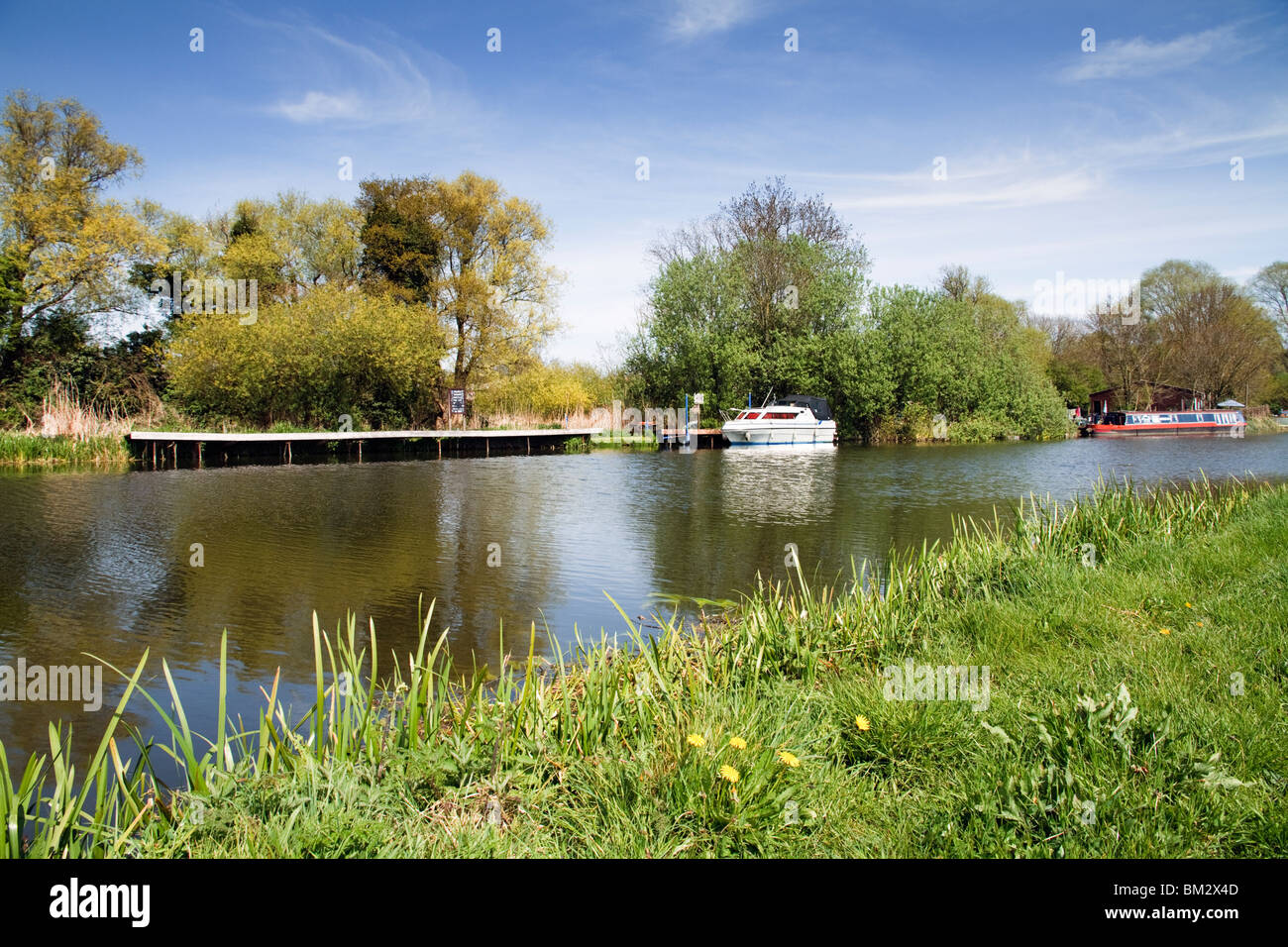 Boat On The River Ouse The Meadows Near Houghton Village In Cambridgeshire, East Anglia England The United Kingdom UK Stock Photo