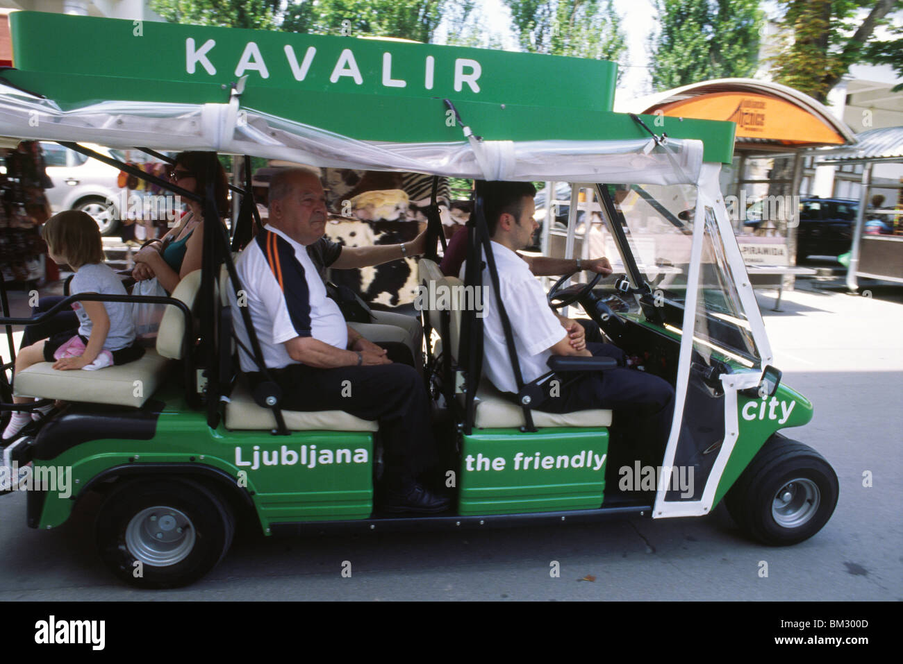 Ljubljana, Slovenia, 15 June 2009 -- 'Kavalir' (gentleman) golf cart crisscrosses Ljubljana. Stock Photo