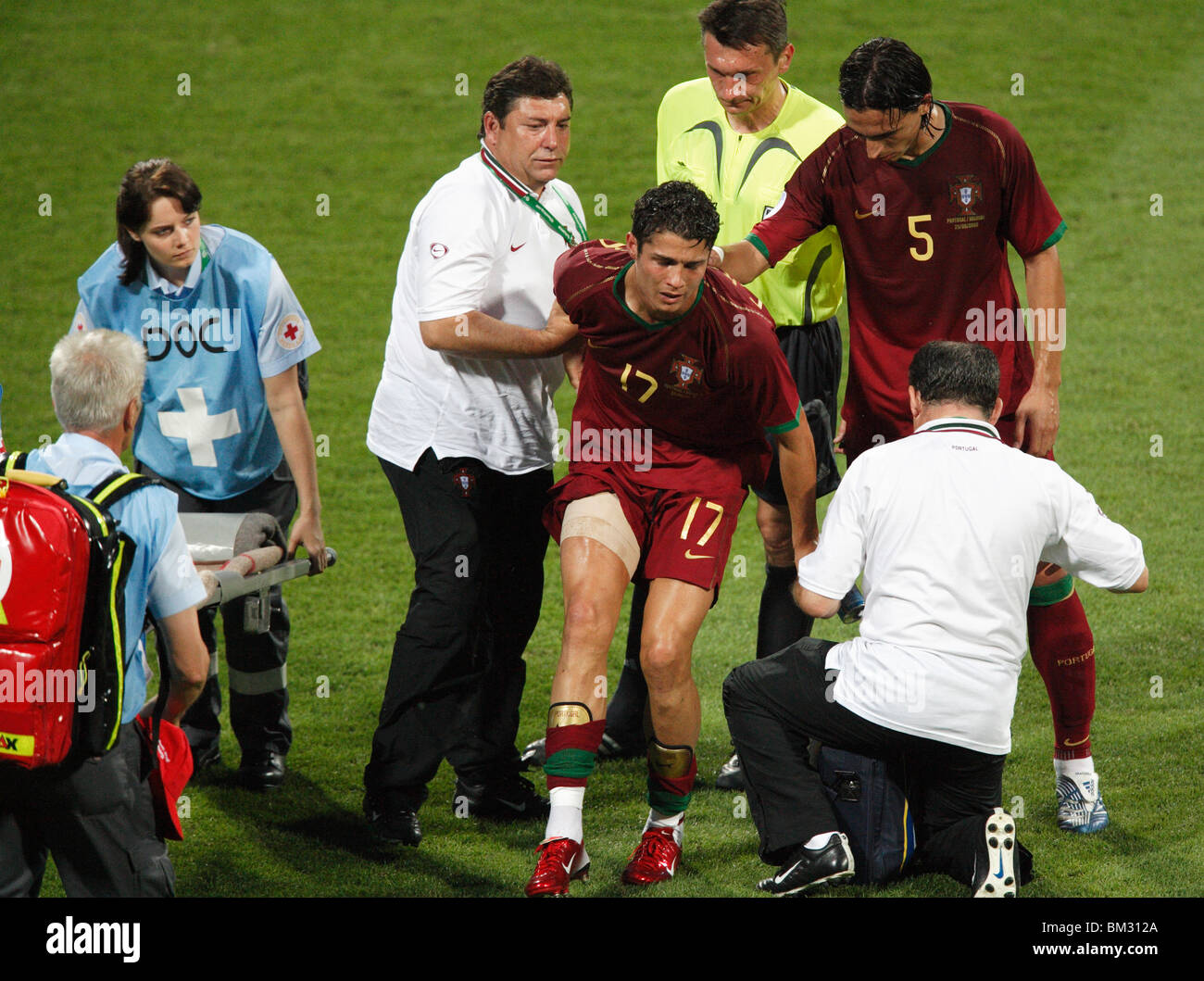 An injured Cristiano Ronaldo of Portugal (17) is helped of the pitch during a round of 16 2006 World Cup match against Holland. Stock Photo