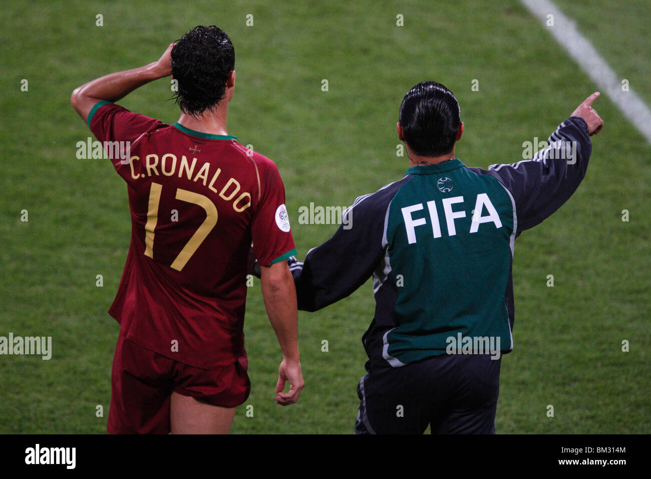 Cristiano Ronaldo of Portugal (l) waits to re-enter a round of 16 2006 World Cup soccer match against the Netherlands. Stock Photo