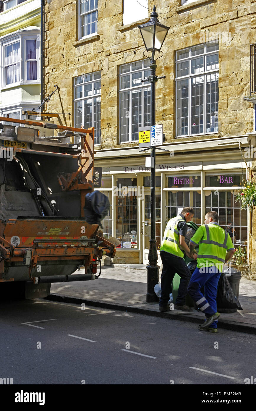 Dustbin men at work on Rubbish collection day in an English town Stock