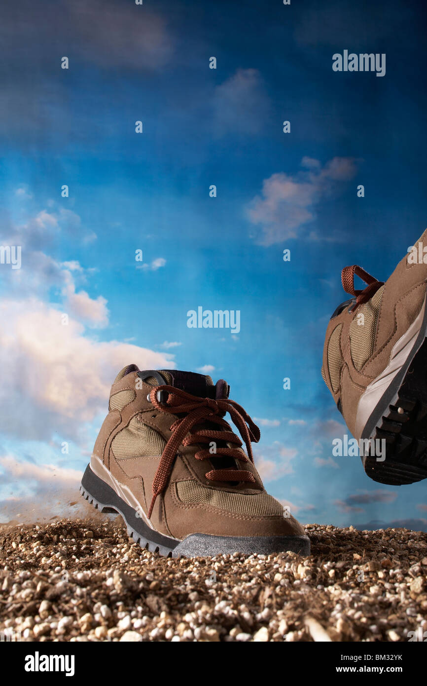 Shoes walking on dirt, computer graphic Stock Photo