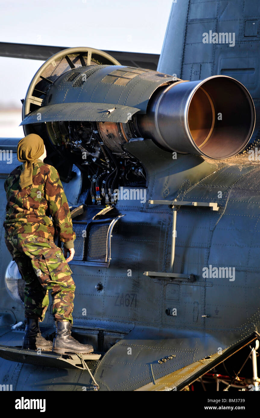 Chinook helicopter, helicopter engineer or mechanic fixes a problem with the engine Stock Photo
