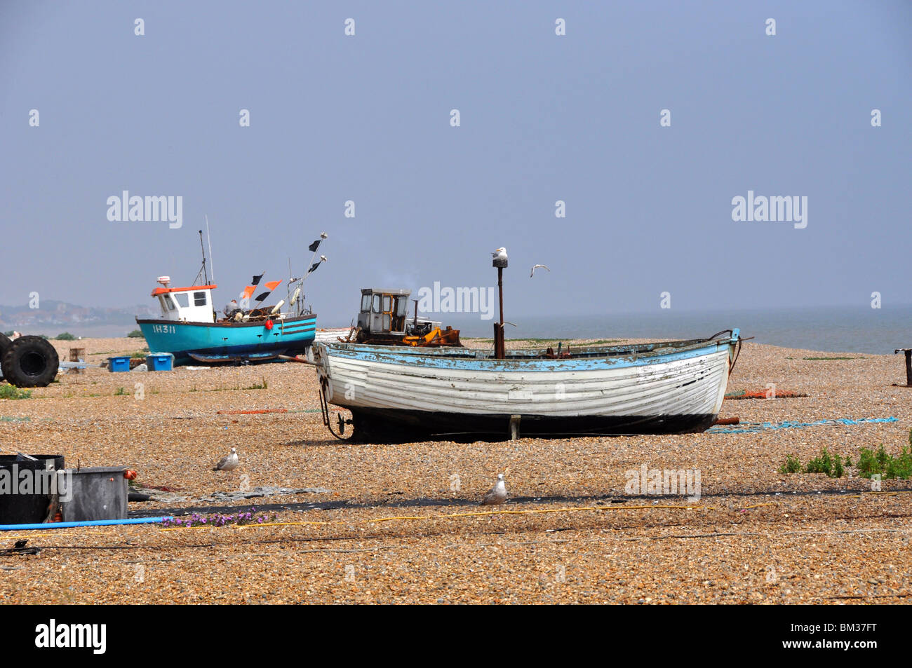 Boats on a pebble beach Southwold Suffolk GB Stock Photo