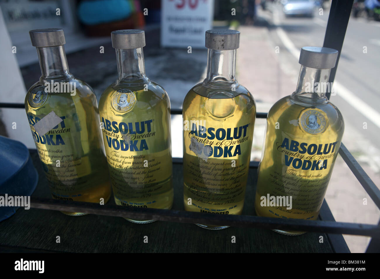 Pertol or gas, commonly stored in Absolut Vodka bottles on the street