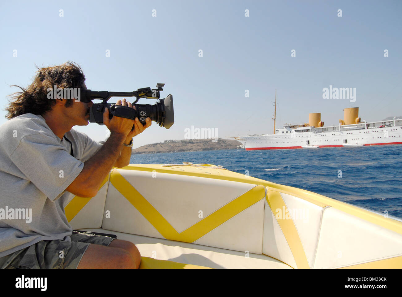 paparazzi peeping a luxury boat with camera, Stock Photo