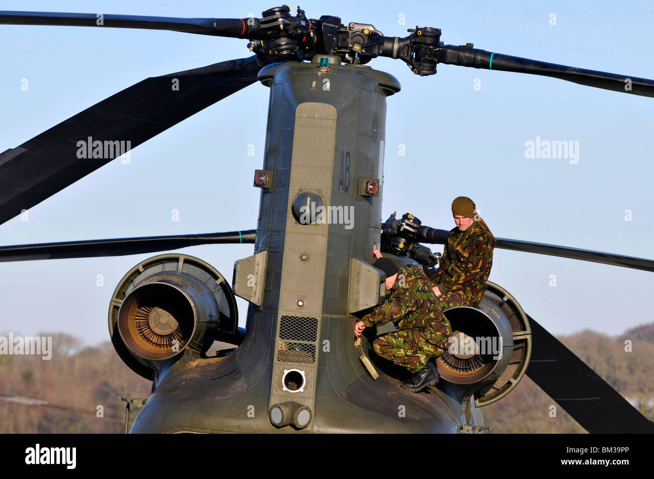 Chinook helicopter, helicopter engineers or mechanics fix a problem with the engine Stock Photo
