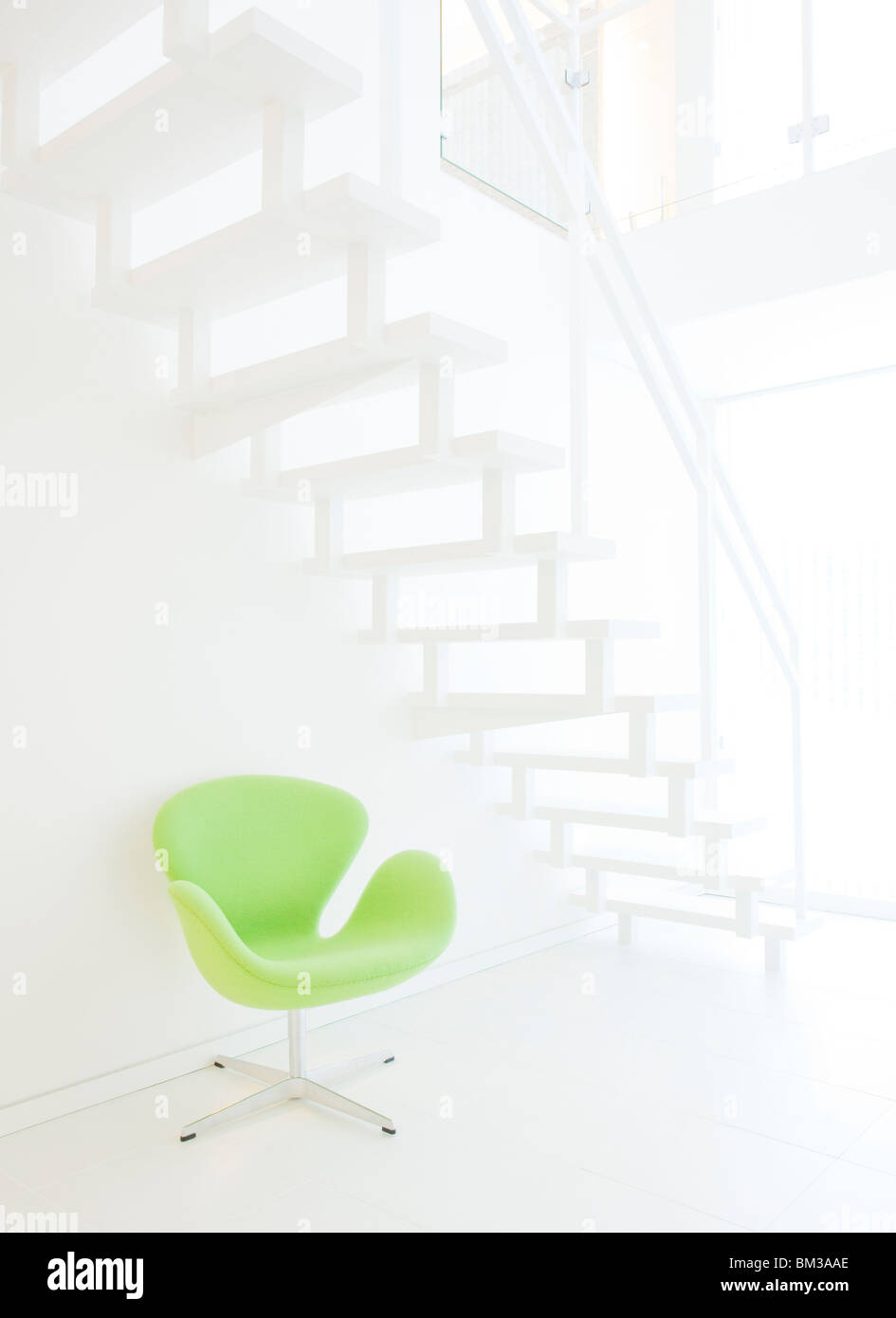 Chair under staircase Stock Photo Alamy