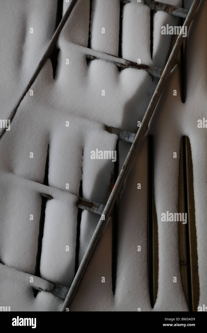 Drifting snow covers a ladder drift drifted floorboards wooden boards