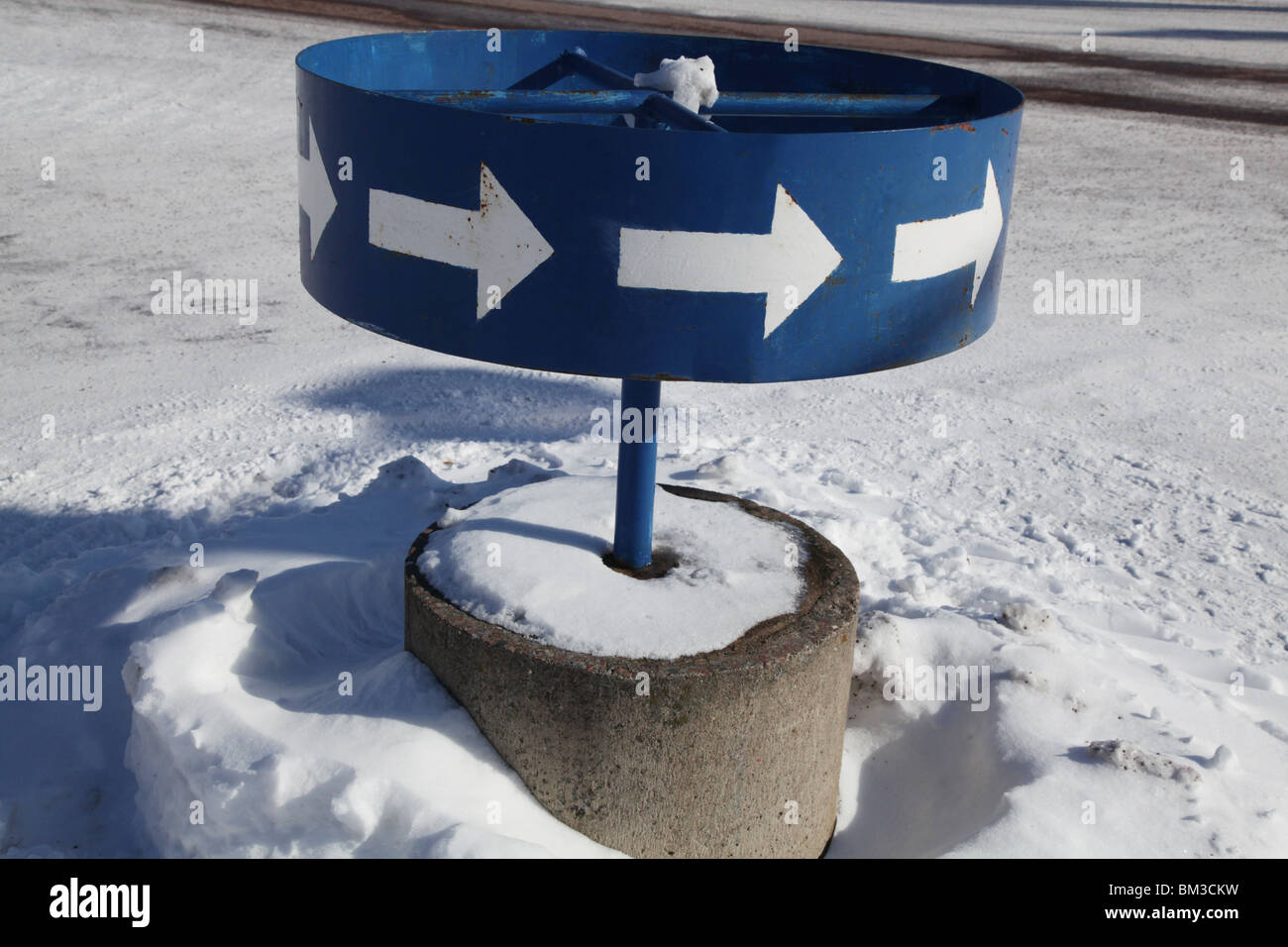 arrows arrow on mini-roundabout round-a-bout roundabout snow Finland Sweden winter Stock Photo