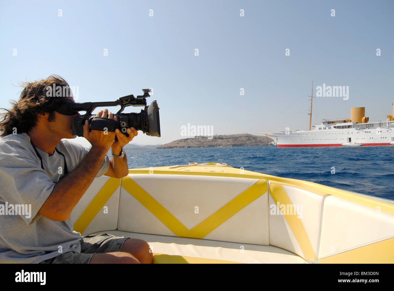 paparazzi peeping a luxury boat with camera, Stock Photo
