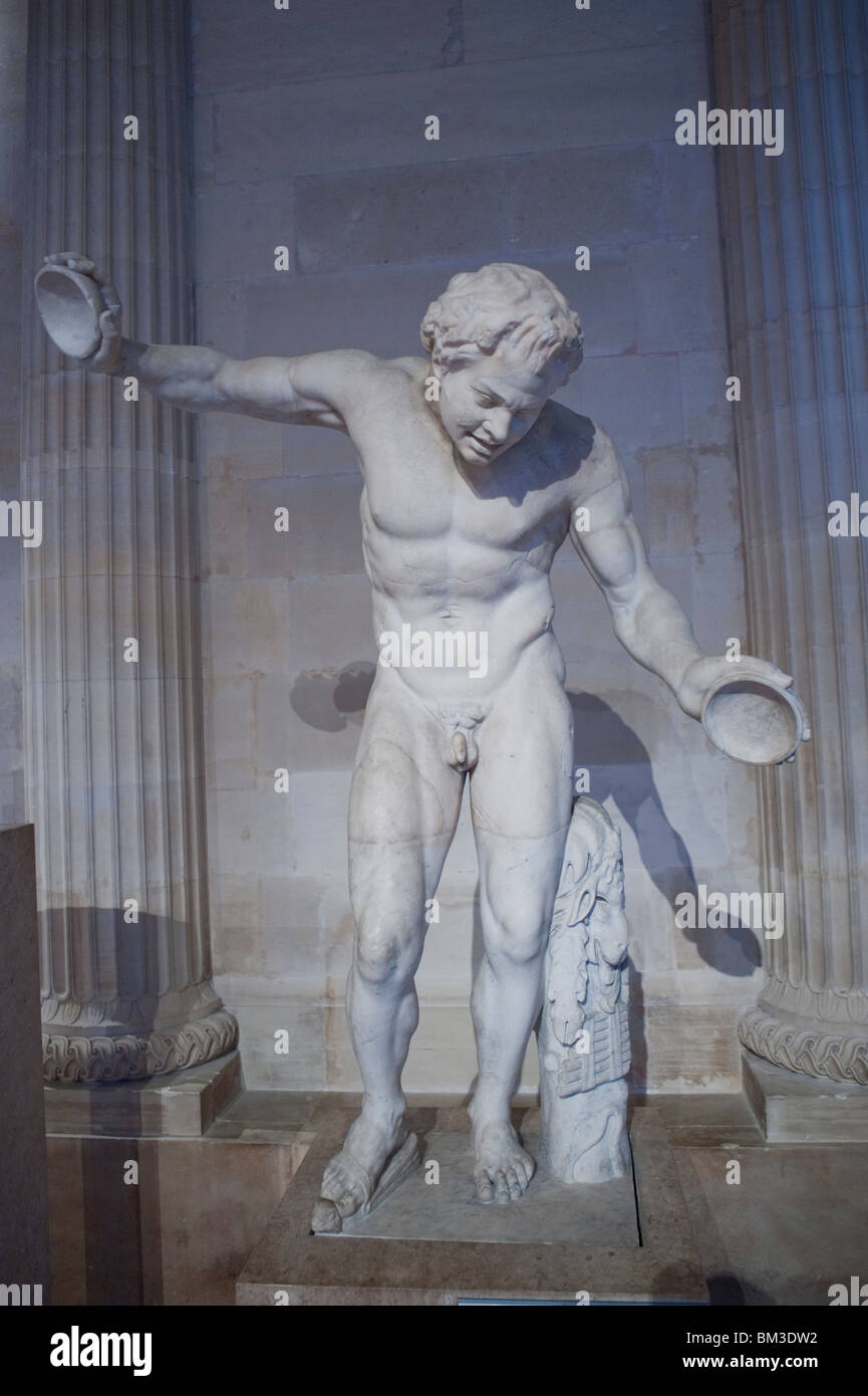 Statue of a Male Greek God, 'Satyre dansant du Groupe dit 'L'Invitation à la Danse' , Marble, in Louvre Museum, Paris, France, Stock Photo