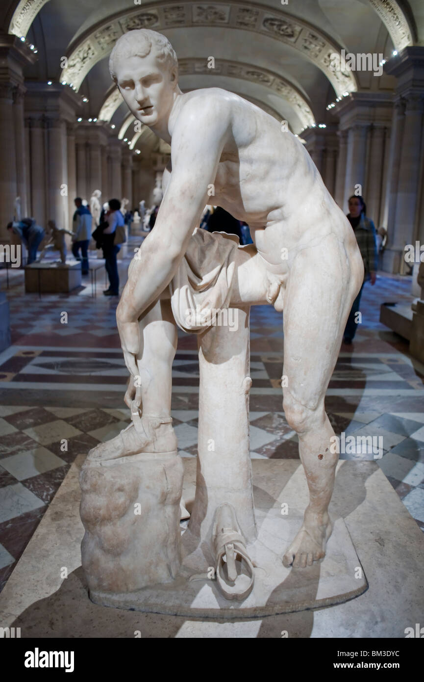 Statue of a Greek God, "Hermes à la Sandale'", in Louvre Museum, Paris,  France, sexuality and body, Marble male Nude Stock Photo - Alamy