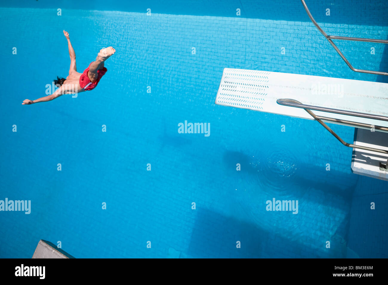Man diving into a pool stock photo alamy