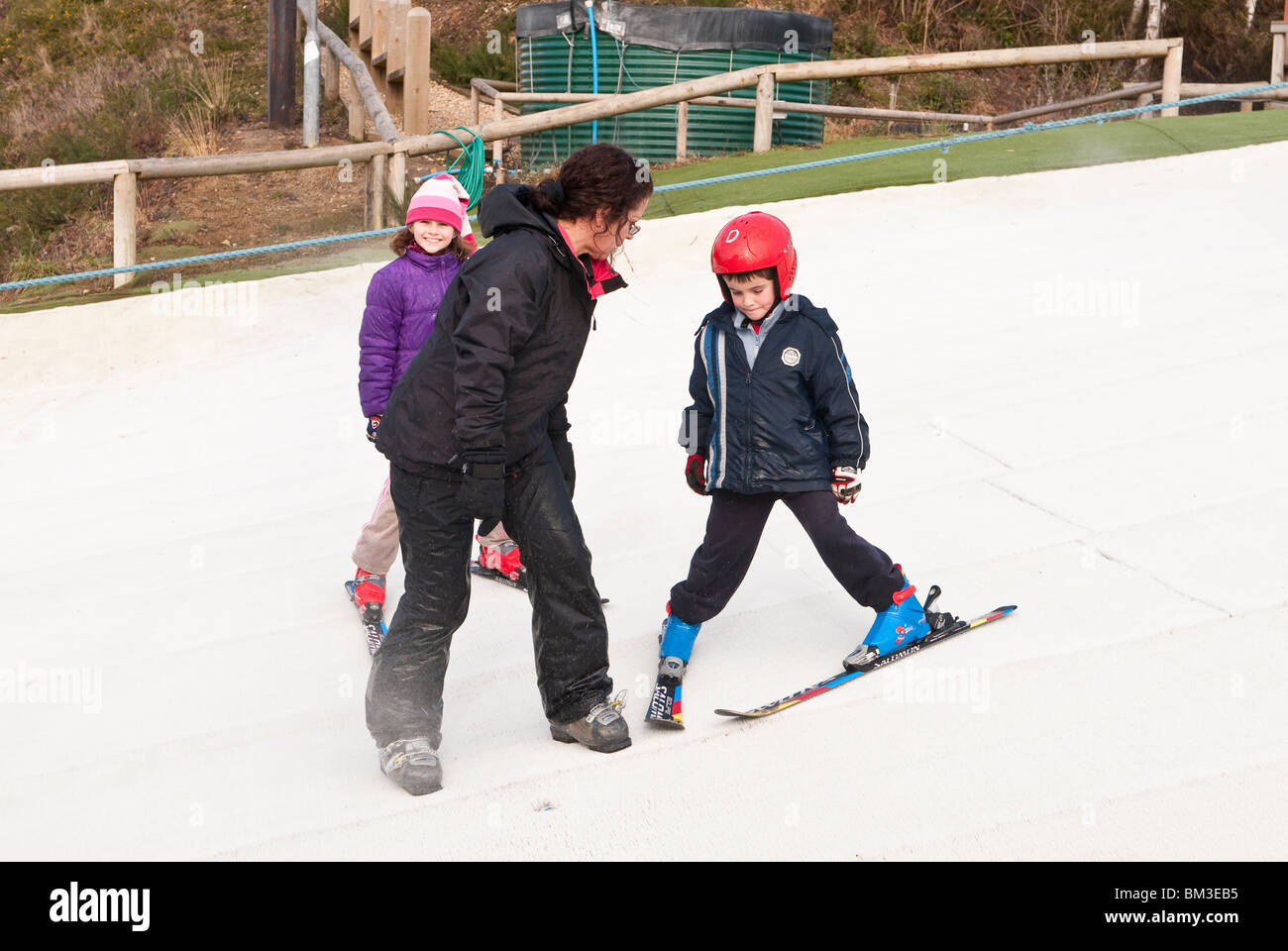 Children Learning to Ski at the Dry Ski Slope in Warmwell Dorset UK Stock Photo