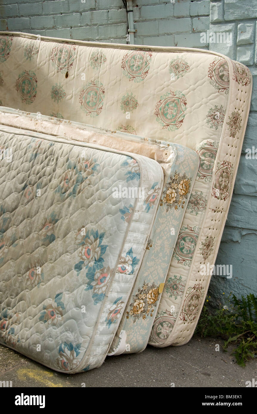 Old mattresses thrown on the street Stock Photo Alamy