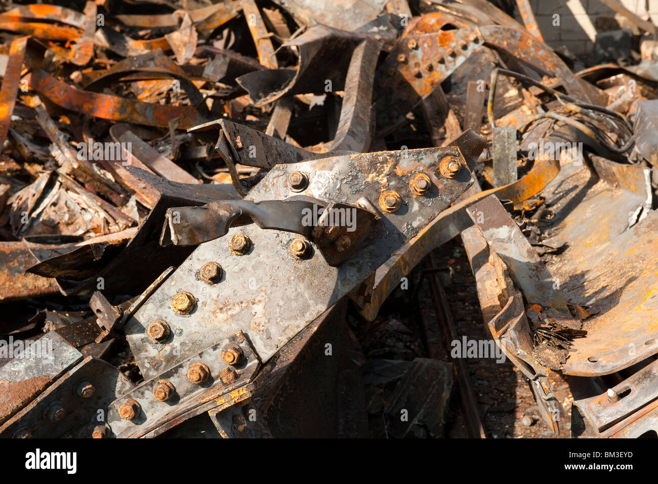 Melted burnt twisted metal steel girders after warehouse factory fire