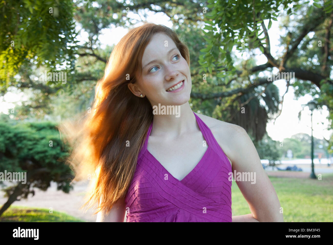 Portrait of a young woman in the park Stock Photo - Alamy