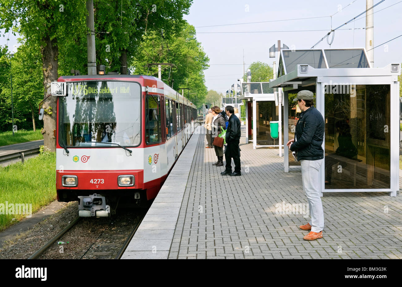 Krefeld to Düsseldorf tram U76 entering Meerbusch Haus Meer station, North Rhein-Westphalia, Germany. Stock Photo