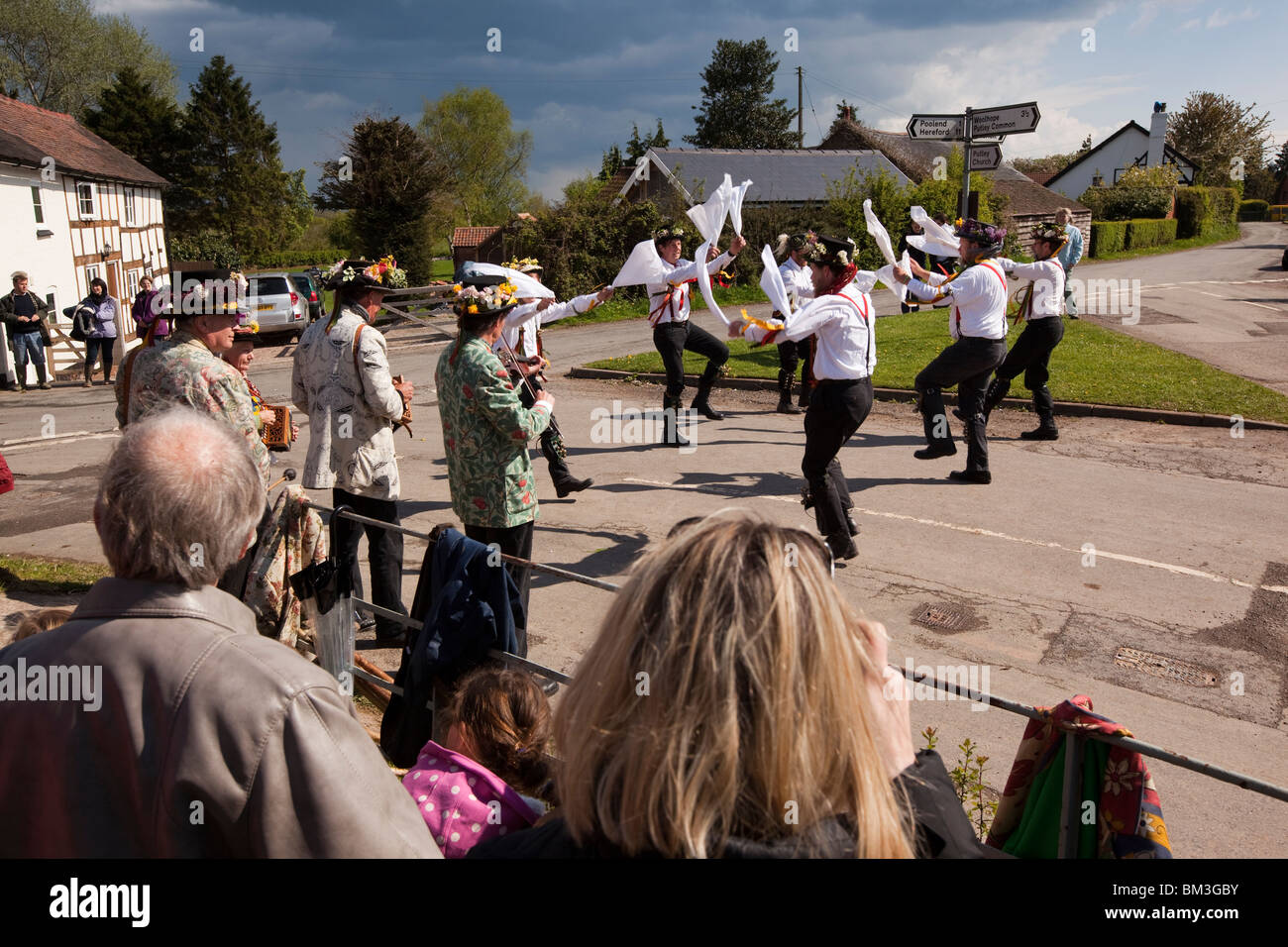 UK, England, Herefordshire, Putley, Big Apple Event, Morris men dancing on village green as rain storm approaches Stock Photo