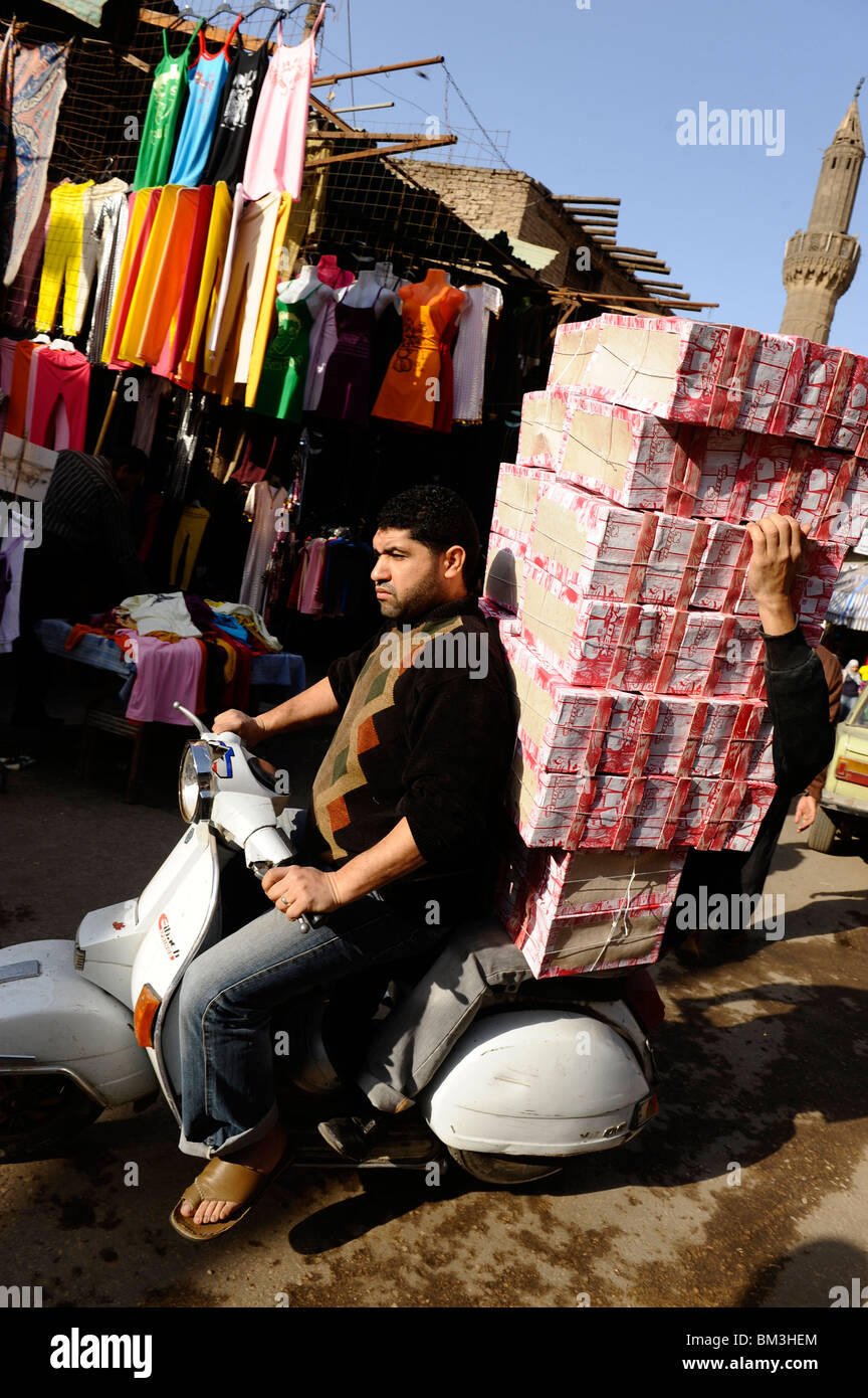 motorcyclist delivering goods in islamic cairo, cairo , egypt Stock Photo