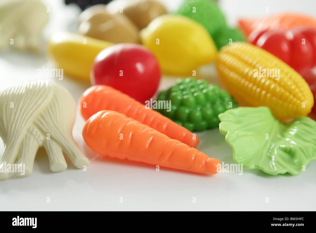 Plastic game, fake varied vegetables and fruits. Children food
