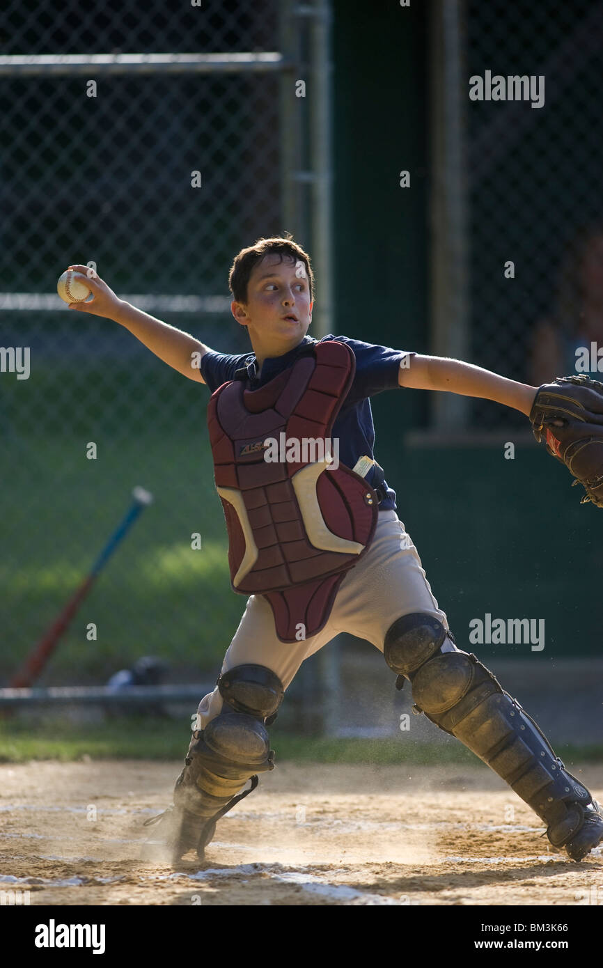 10 year old boy catching during baseball game Stock Photo Alamy