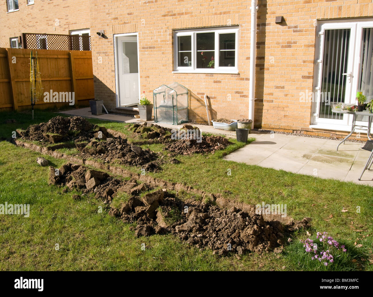 Trenches Dug Into A Garden Of A New Build House In Preparation Of