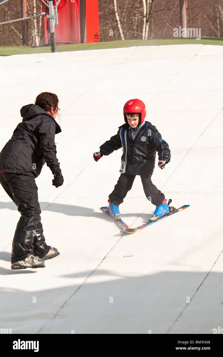 Child Learning to Ski at the Dry Ski Slope in Warmwell Dorset UK Stock