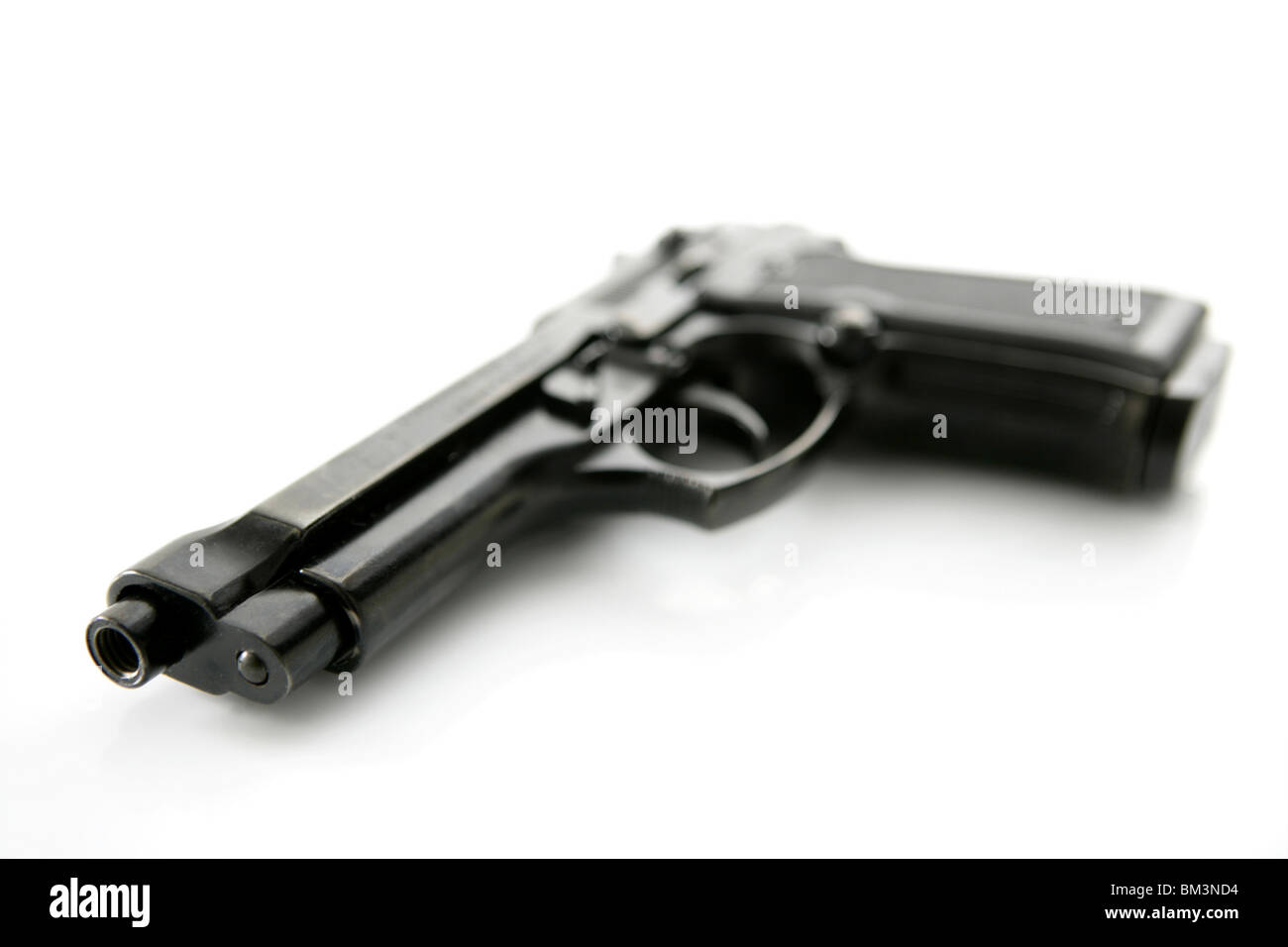 black hand gun pistol over white background, selective focus, studio shot Stock Photo