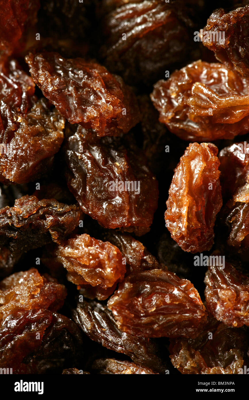 dried raisin macro texture in a close up crop. natural fruits brown