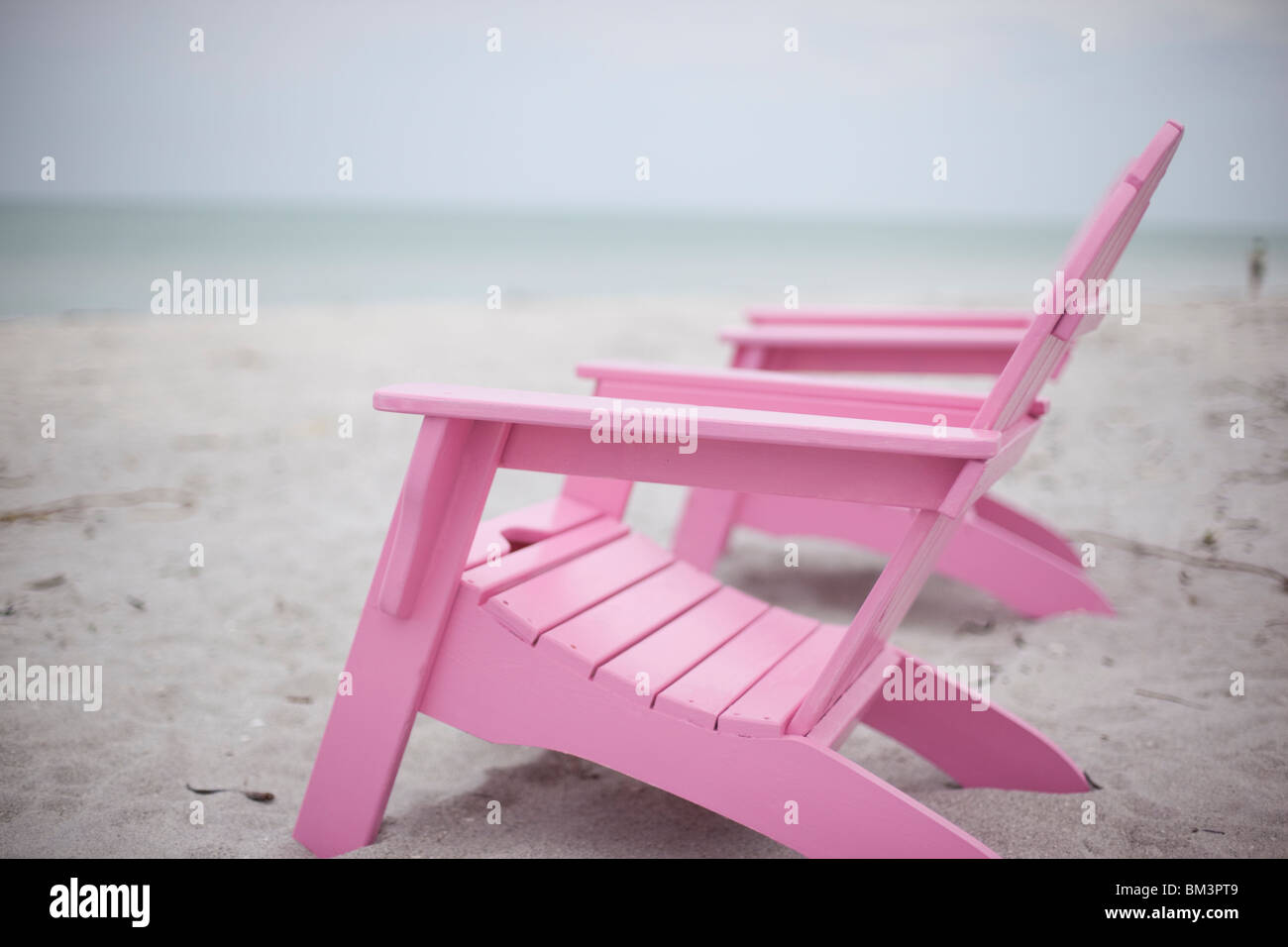 Pink Adirondack Chairs On A White Sand Beach Stock Photo Alamy