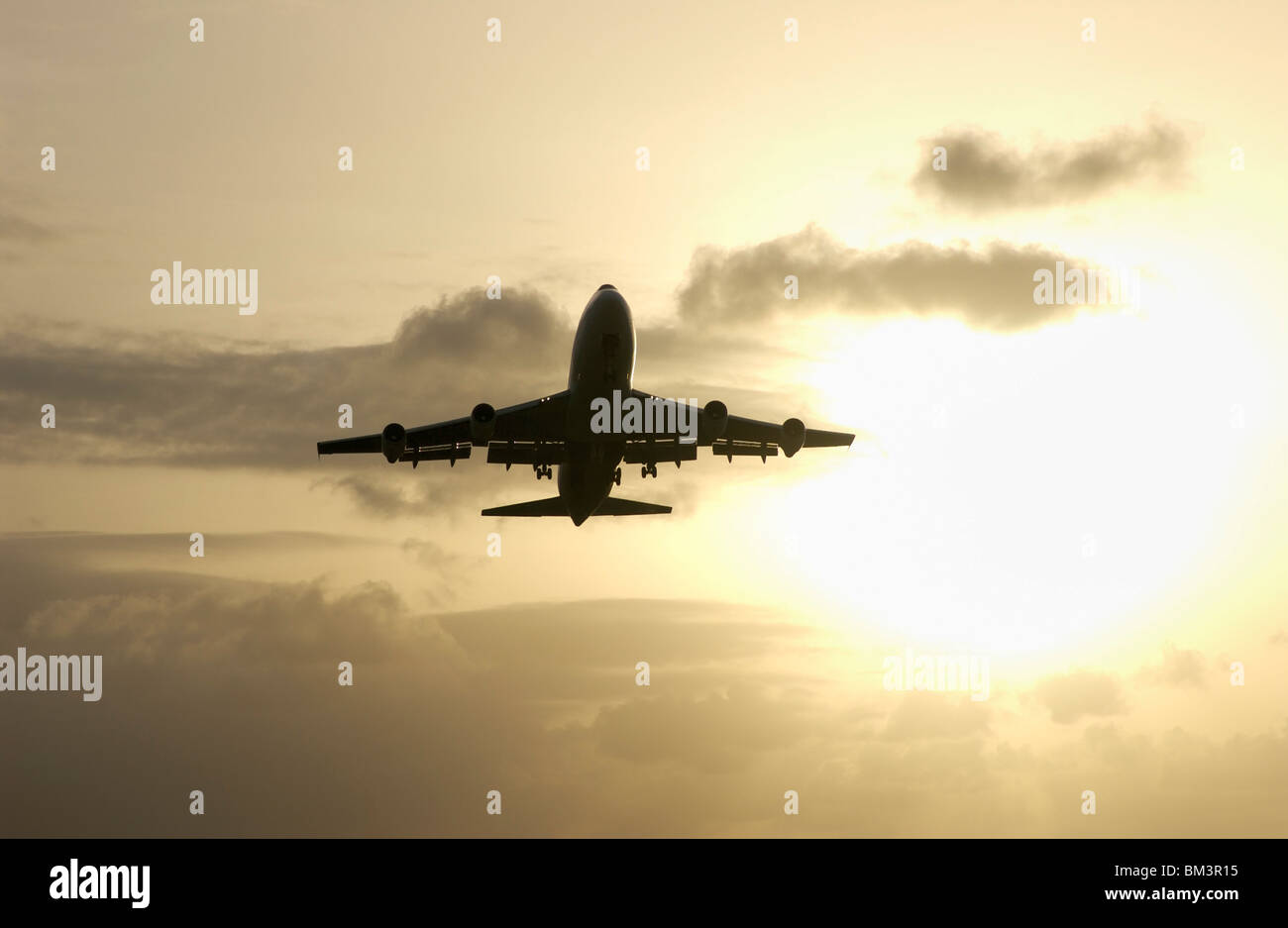 A Boeing 747 jumbo jet departing Point à Pitre airport (PTP) at sunset, Guadeloupe FR Stock Photo