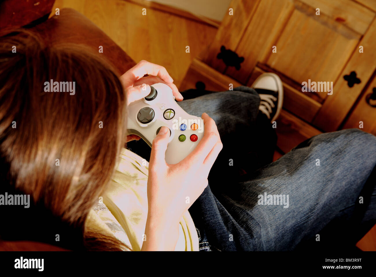 teenager playing video games Stock Photo