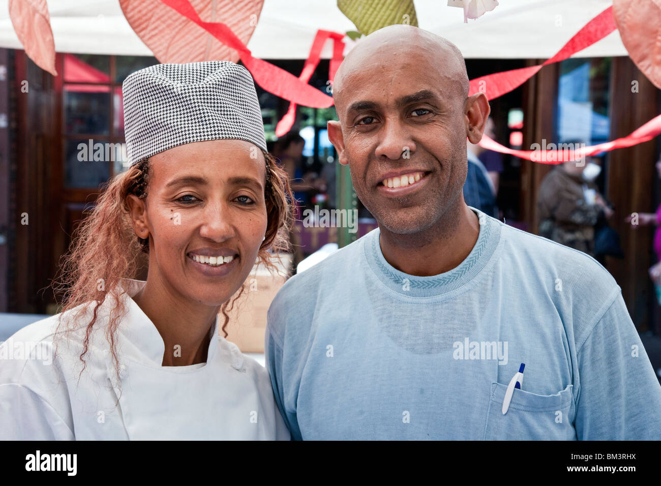 Ethiopian chef Elsabet & her husband at their restaurant food stand at Ninth Avenue international Food festival New York City Stock Photo