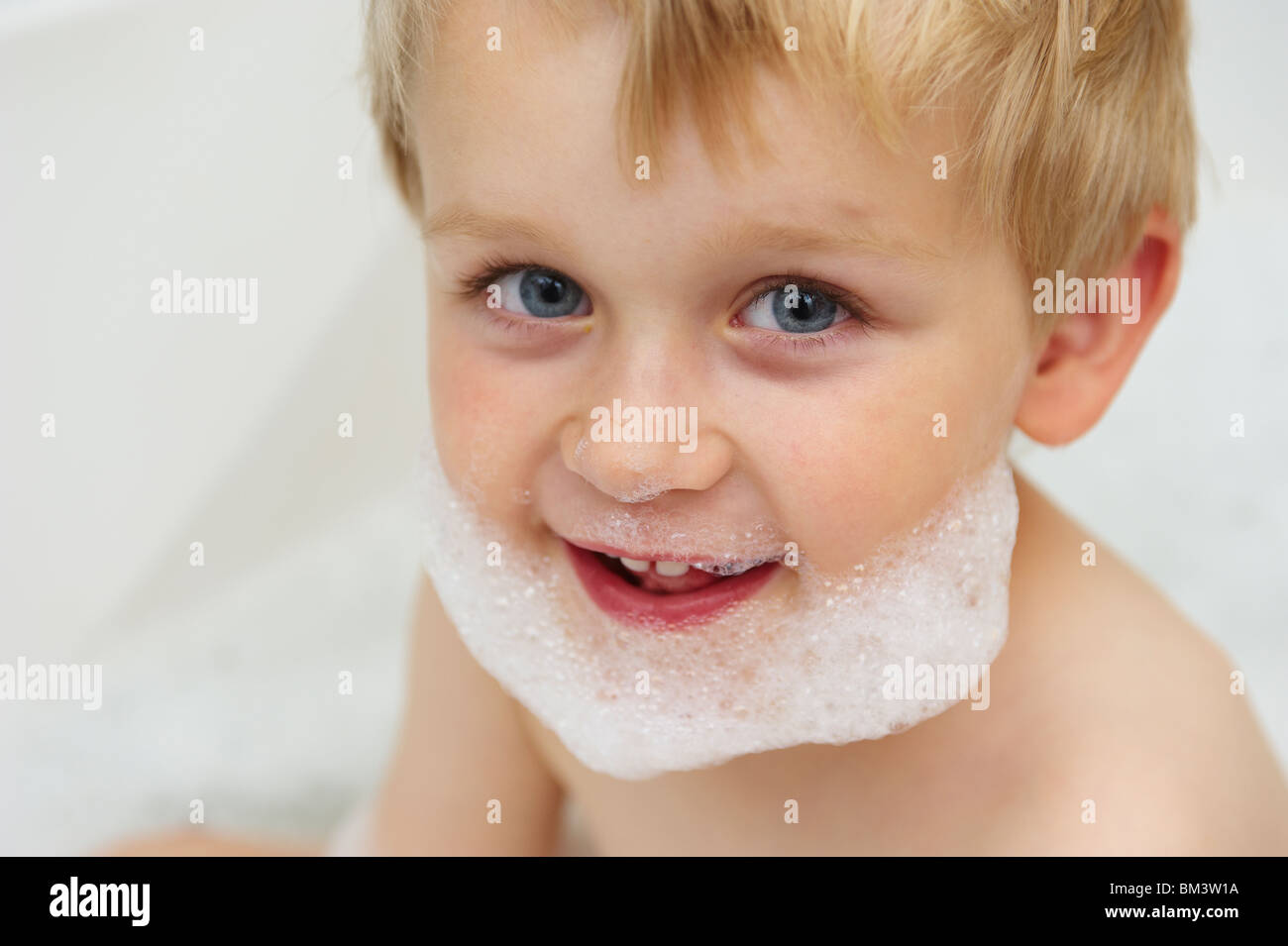 Young child boy taking bubble bath portrait Stock Photo Alamy