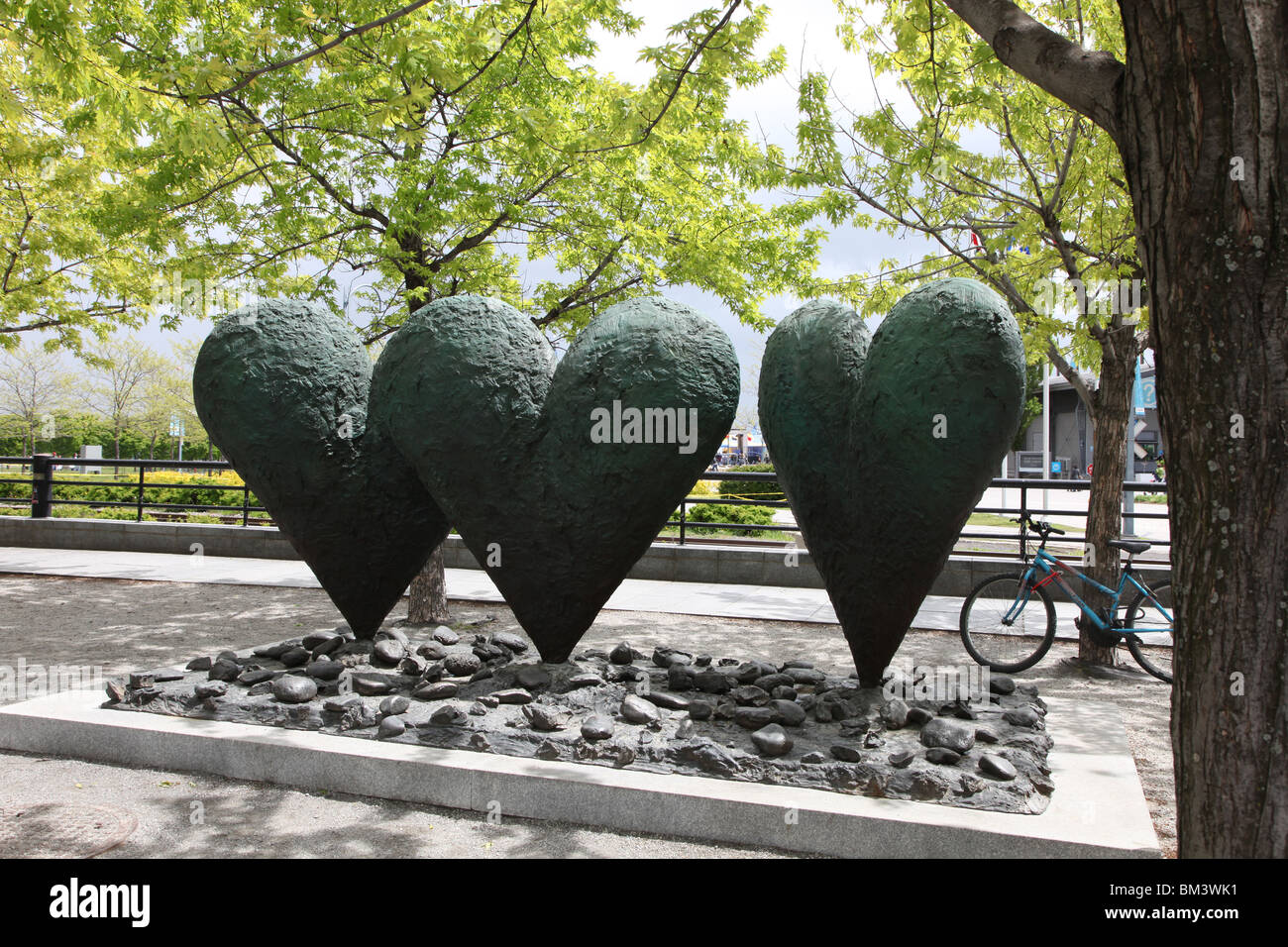 Jim Dine Sculpture Three Hearts on a Rock, Vieux Ville, Montreal Stock Photo