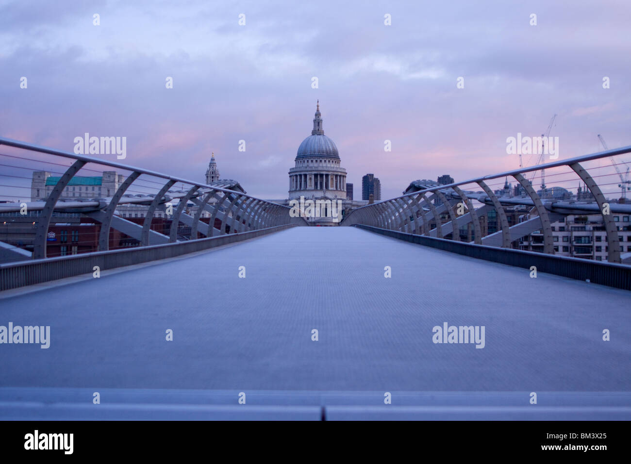 St Pauls cathedral seen from the millennium bridge at dawn, London Stock Photo