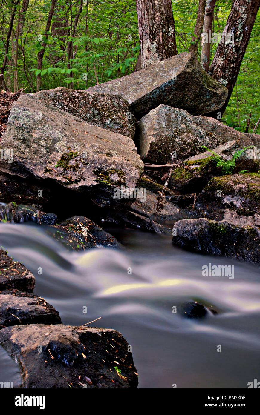 water flowing over the rocks. Stock Photo