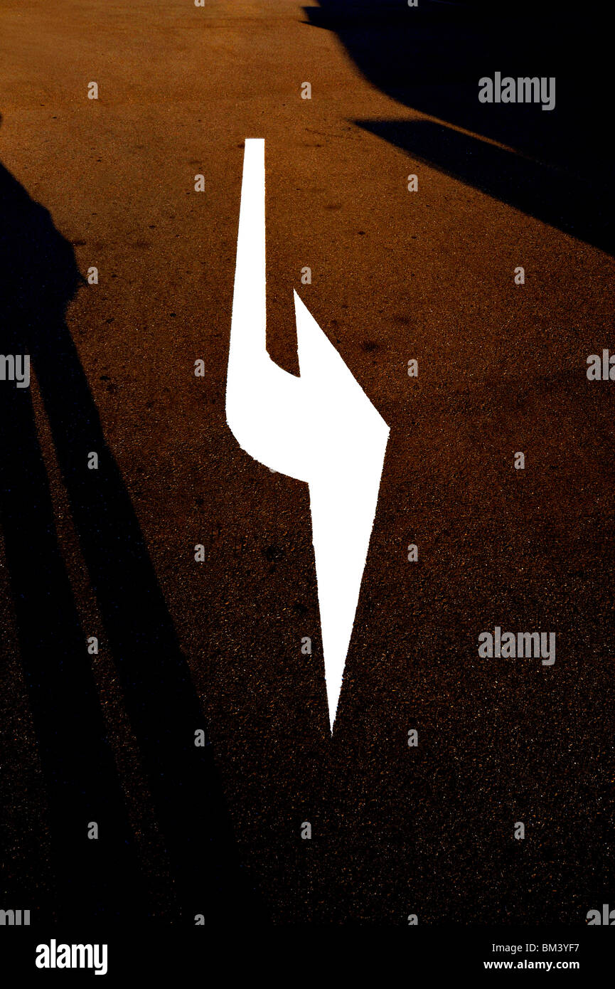 Arrow sign on road Stock Photo