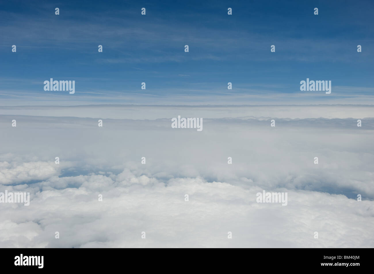 View from a passenger plane's window with blue sky and clouds, 2010 Stock Photo