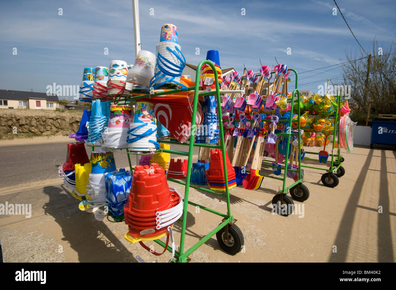 beach goods and toys for sale in racks at shop Camber Sands Beach in